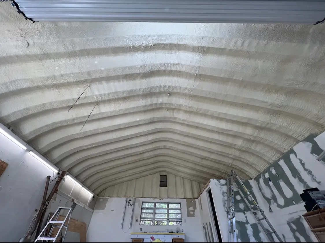 Spray polyurethane foam applied to the underside of a metal roof deck in Wilkinsburg